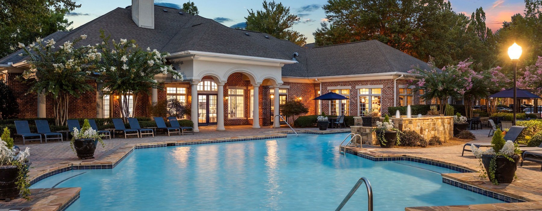 Resort-style swimming pool pool with lounge chairs