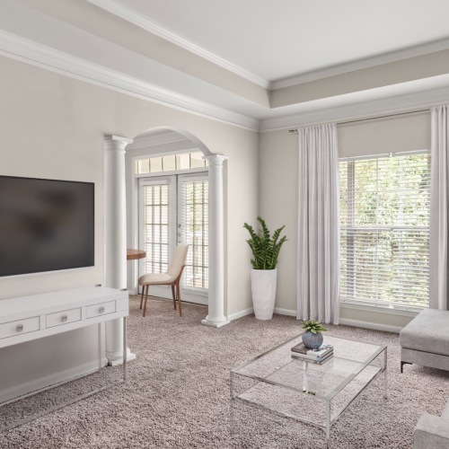 Generous living spaces with beautiful natural lighting Living room with patio, oversized windows, seating, accent rug, and kitchen bar with stools